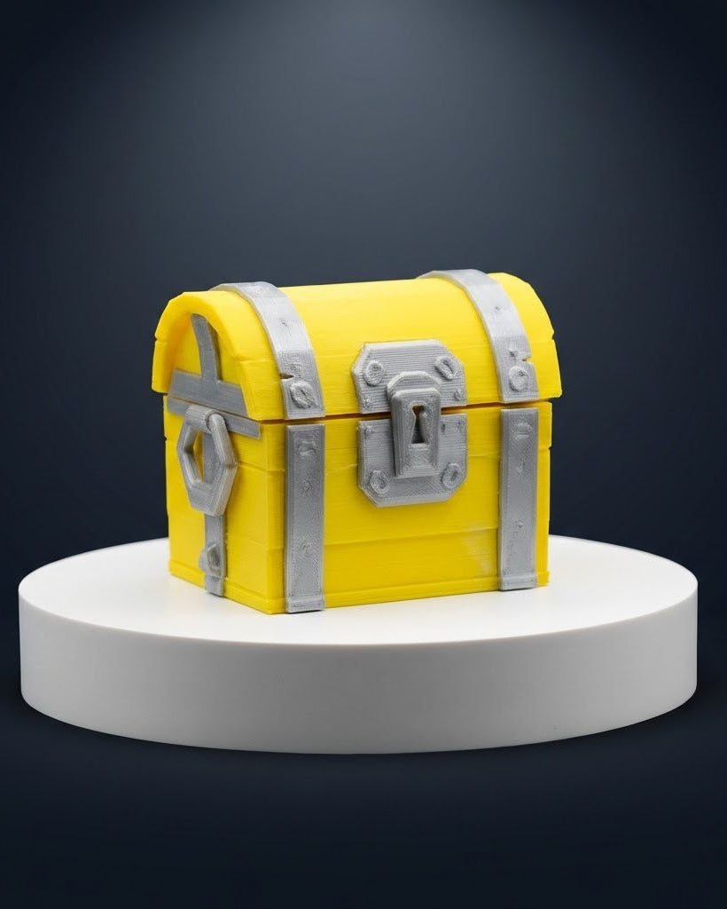 Yellow treasure chest with silver lock on a gray background